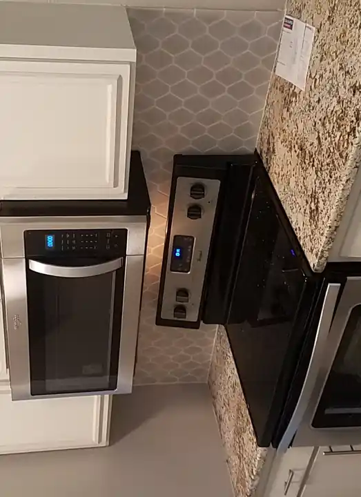 Finished white hexagon kitchen backsplash detail in Waxahachie Texas