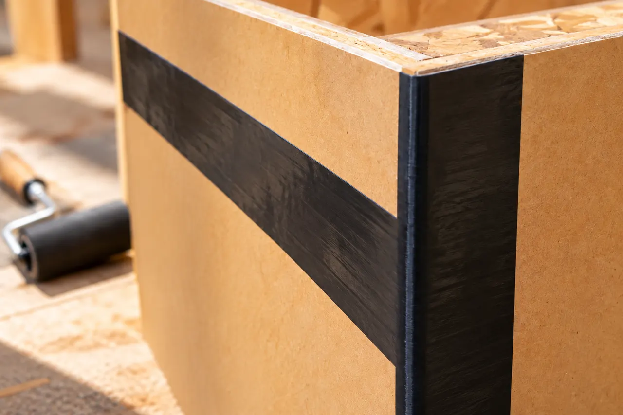 Integrated sheathing and seam treatment — Rockwall
