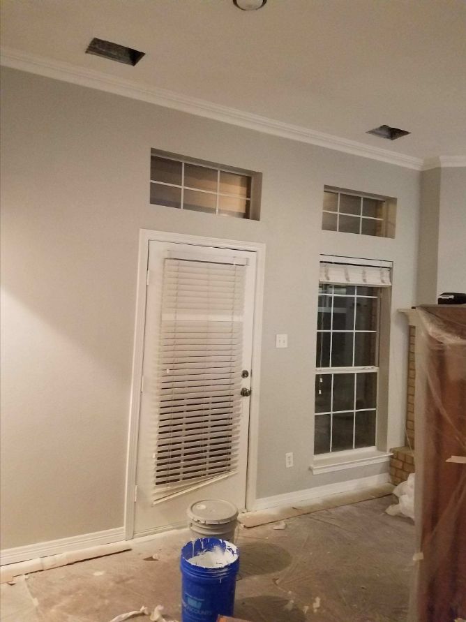 Protected floors and fixtures during interior painting and trim work in a Dallas-Fort Worth home