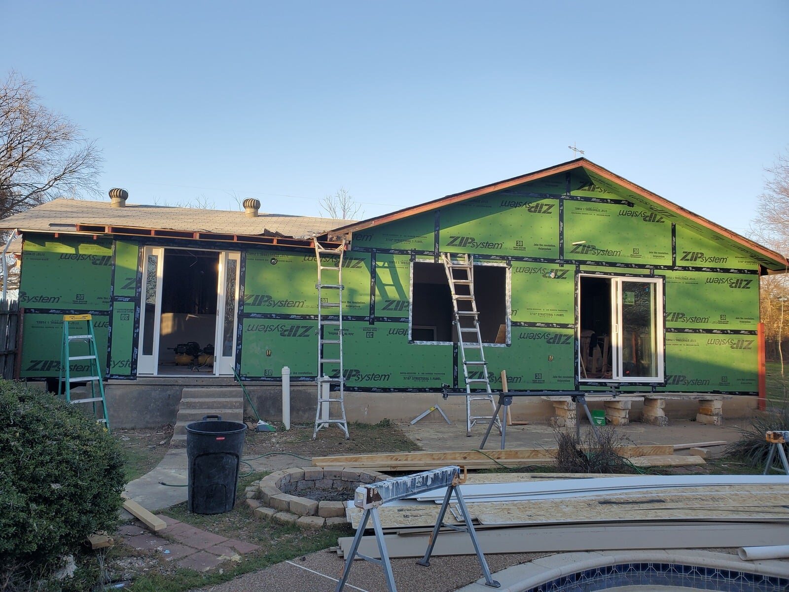 Home exterior during siding installation